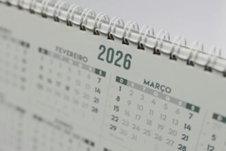 Close-up view of a 2026 spiral-bound desk calendar showing February and March.