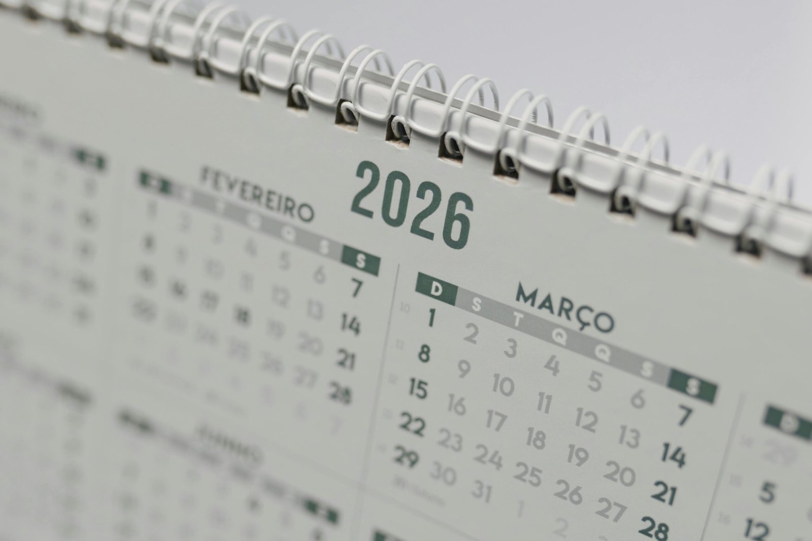 Close-up view of a 2026 spiral-bound desk calendar showing February and March.